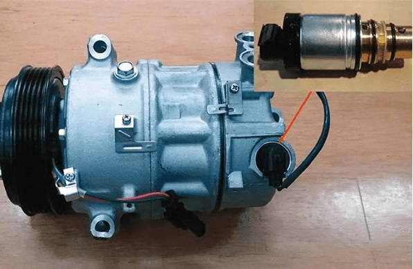 the location of the car AC compressor control valve